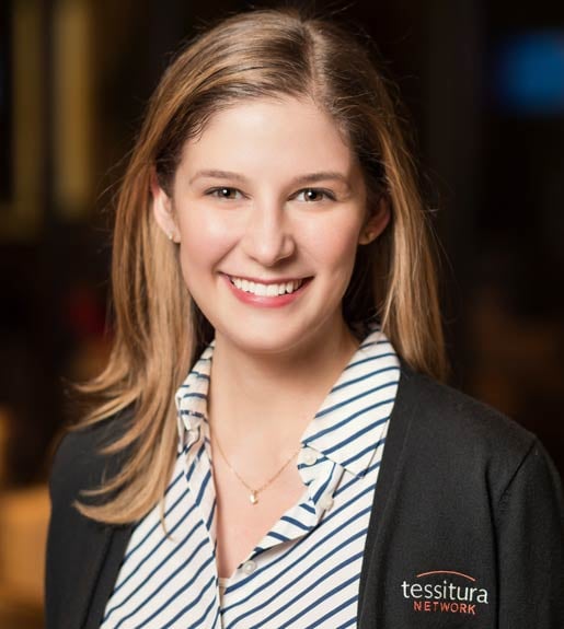 Jenifer LaMorte, seen from the torso up, wearing a top with diagonal stripes, facing forward and smiling.
