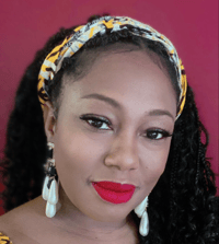 Headshot of Shenette Swann with long black hair, a colorful headband, and large white dangling earrings.