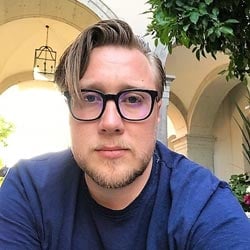 Kayleb wearing eyeglasses and a blue shirt.
