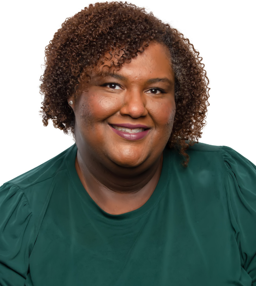 Lauren Gayden, seen from the torso up, wearing a forest green top.