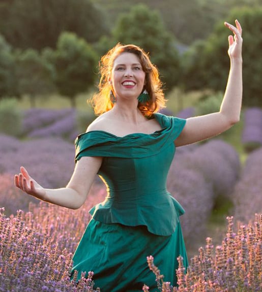 Katrina Waters stands in a field of lavender.