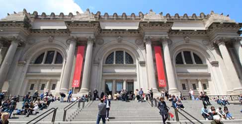 The facade of the Metropolitan Museum of Art, seen from the sidewalk below