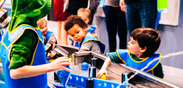 Children interact with an exhibit at Michigan Science Center.