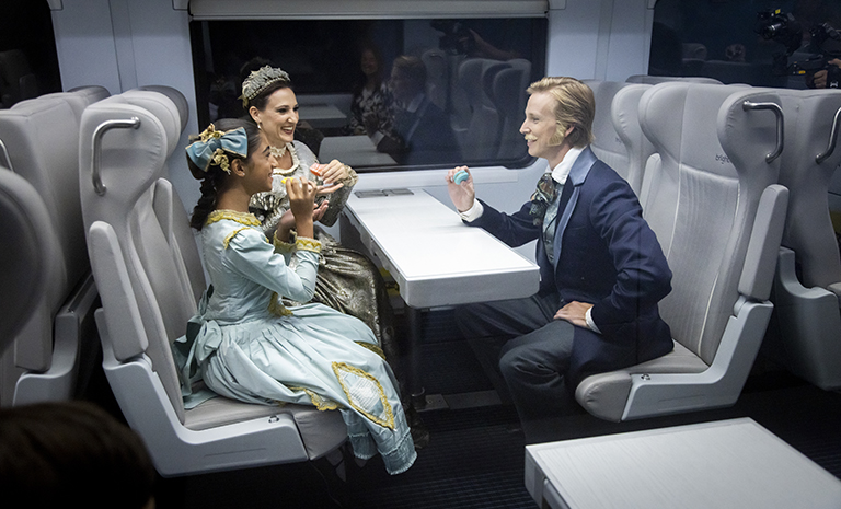 Costumed characters from The Nutcracker enjoy snacks aboard the Brightline train to promote a partnership with Miami City Ballet.