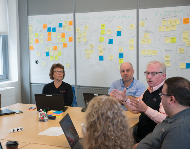 A group of people at a conference table