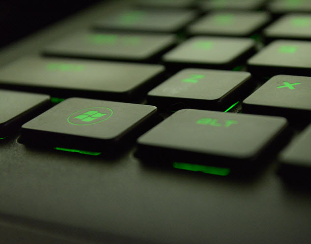a laptop keyboard with illuminated keys