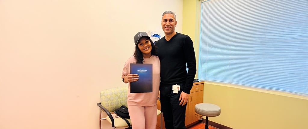 Aline Kidd photo with another person in an office setting