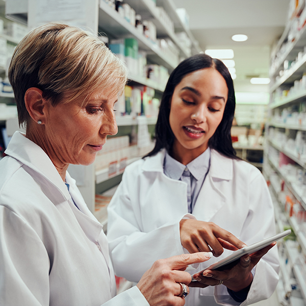 Pharmacists reviewing paperwork
