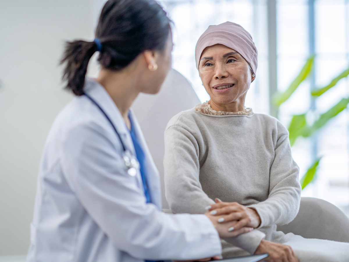 Doctor consoling a cancer patient