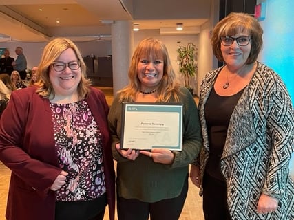 Pamela Swampy (Centre), Guest Services Representative 2002 Outstanding New Journeyperson Award recipient, at Saskatchewan Apprenticeship Awards, Conexus Arts Centre, Regina, November 4, 2022, seen here with Tourism Saskatchewan Vice-President of Destination and Workforce Development Tracy Breher and Resource and Exam Centre Coordinator Lendee Wiebe.