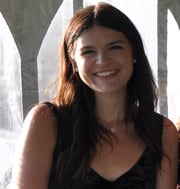 Kayla Parkalub standing inside a marquee tent with white walls