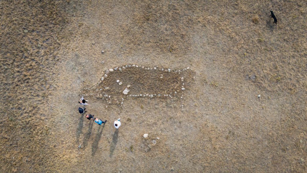 aerial top down photo of a tour group viewing an indigenous buffalo effigy