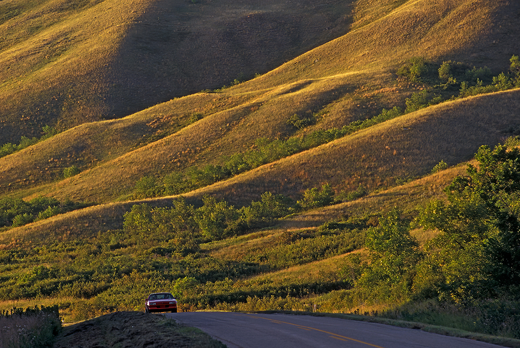 Car driving on road in Qu'Appelle Valley