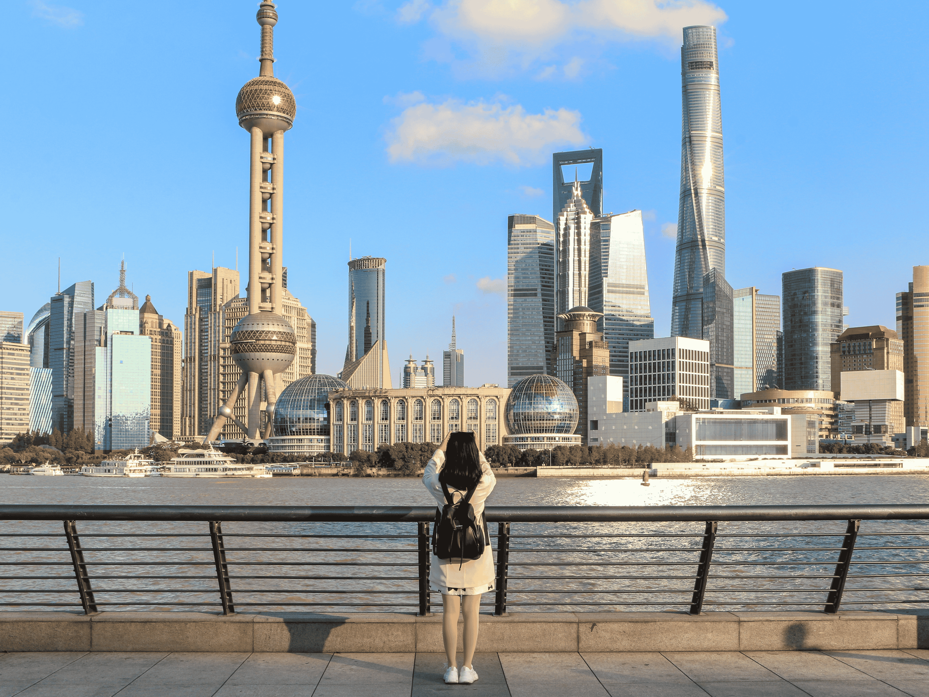 Girl looking at Shanghai skyline in China