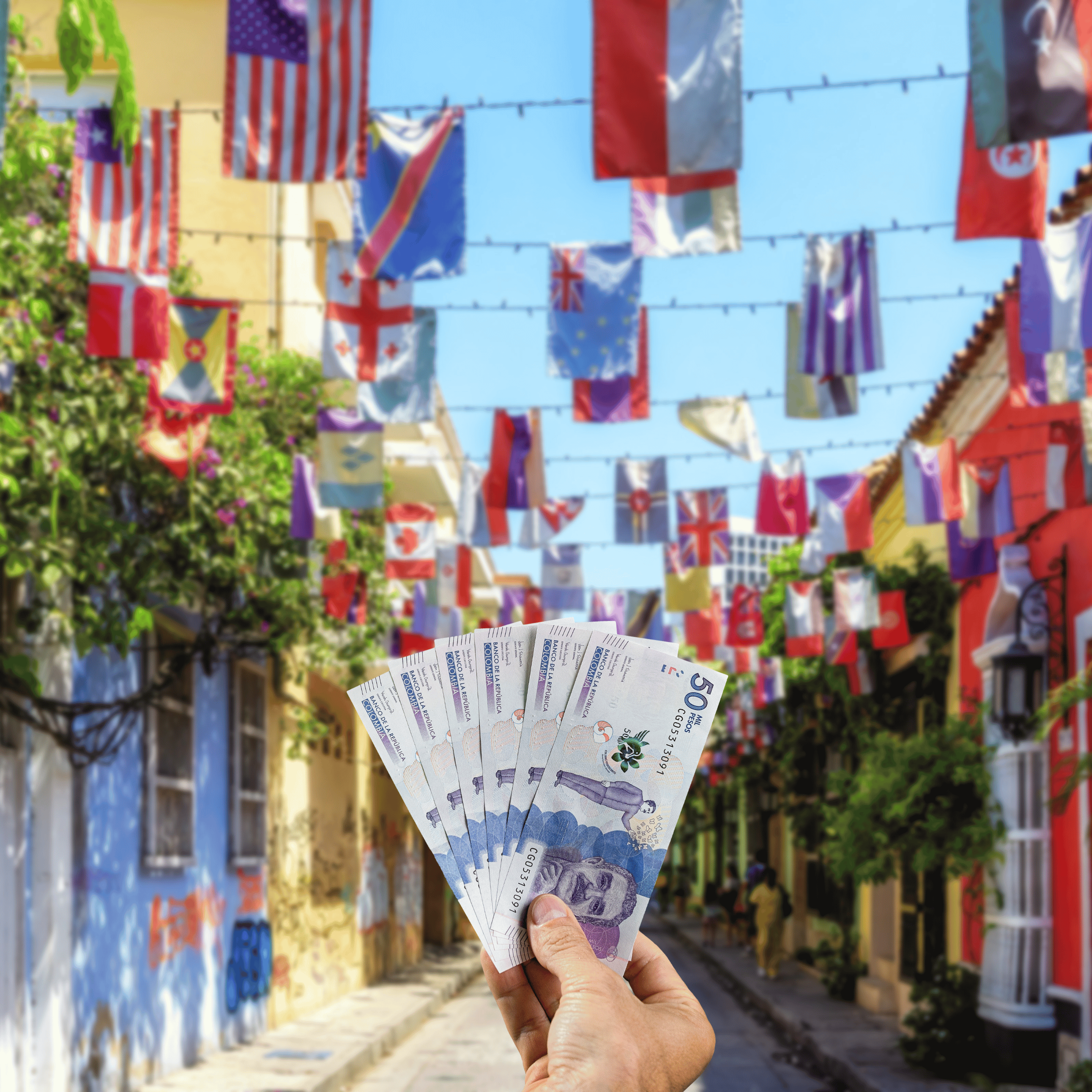 Traveller holding Colombian Peso (COP) currency in front of Cartagena street in Colombia