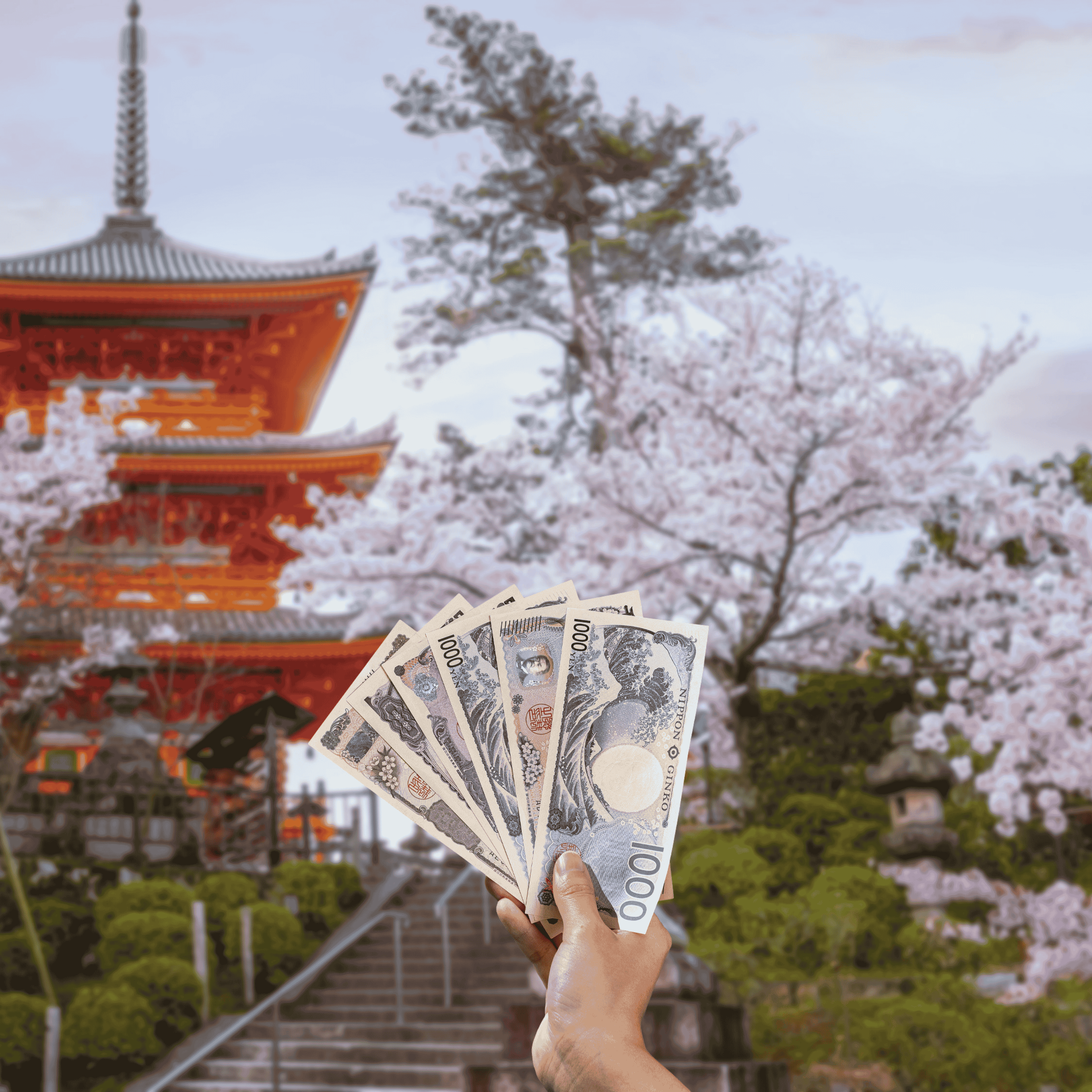 Traveller holding Japanese Yen (JPY) currency in front view of Kiyomizu Temple and cherry blossoms in Kyoto, Japan