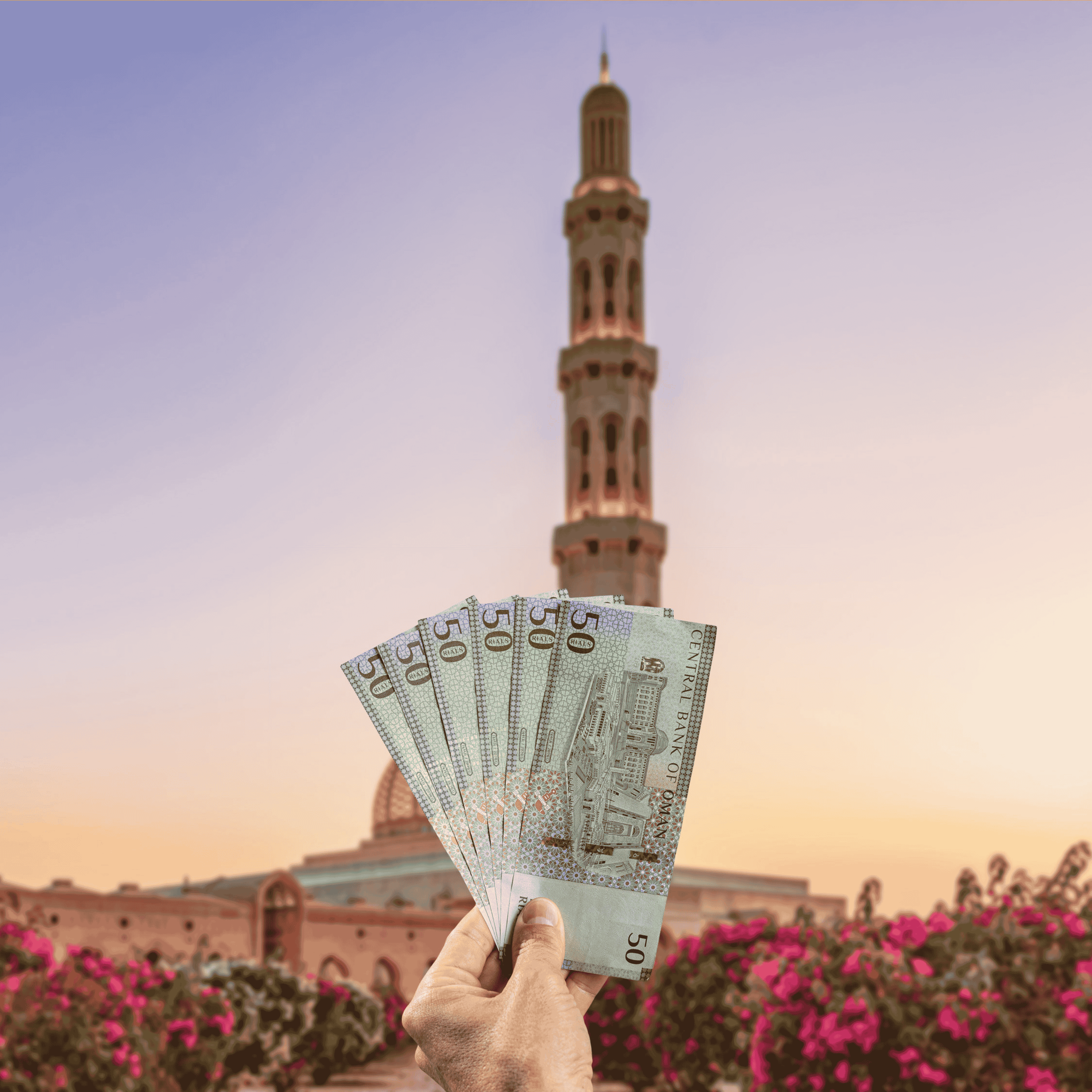 Traveller holding Omani Rial (OMR) currency in Muscat, Oman