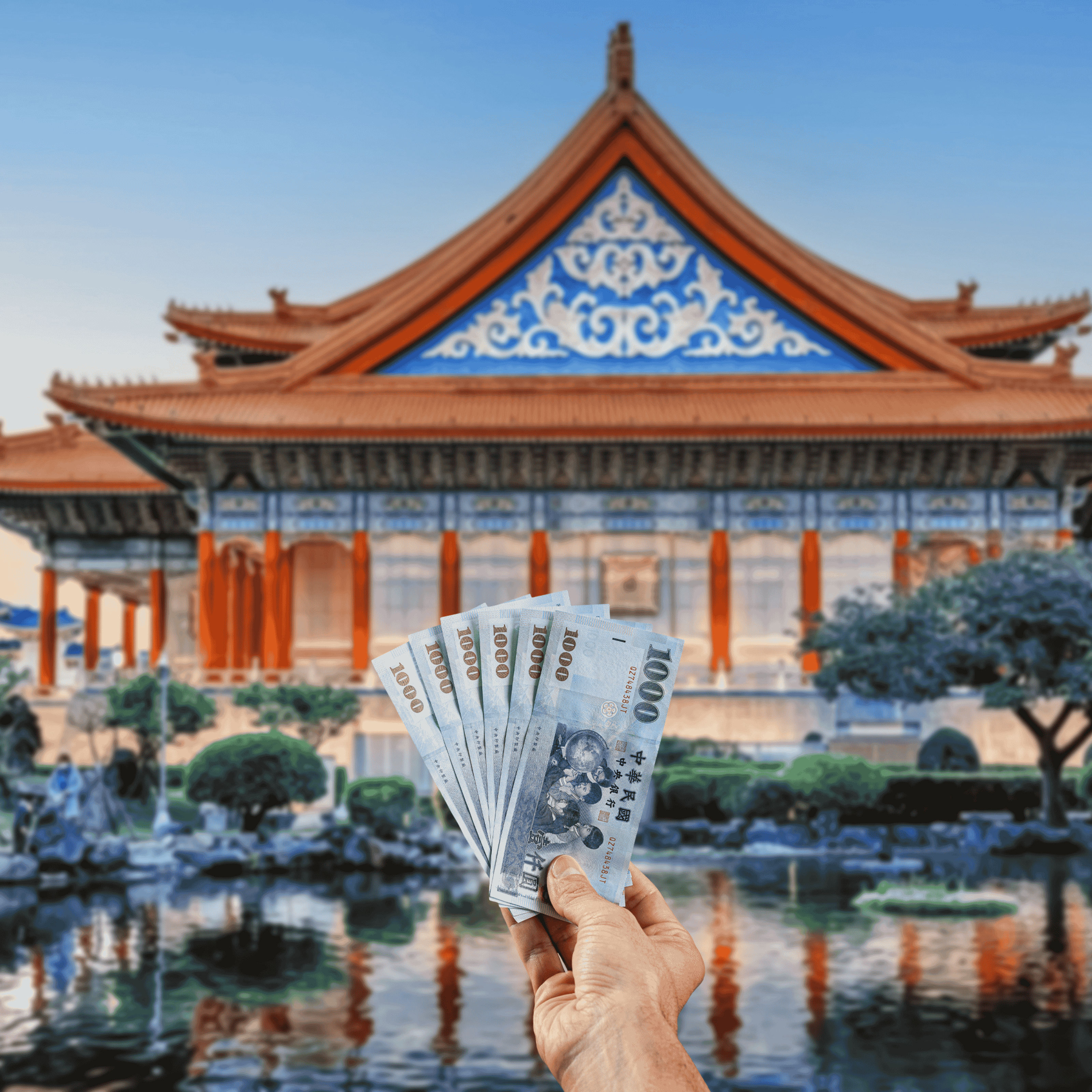 Traveller holding New Taiwan Dollars (TWD) currency in front of view of temple in Taiwan