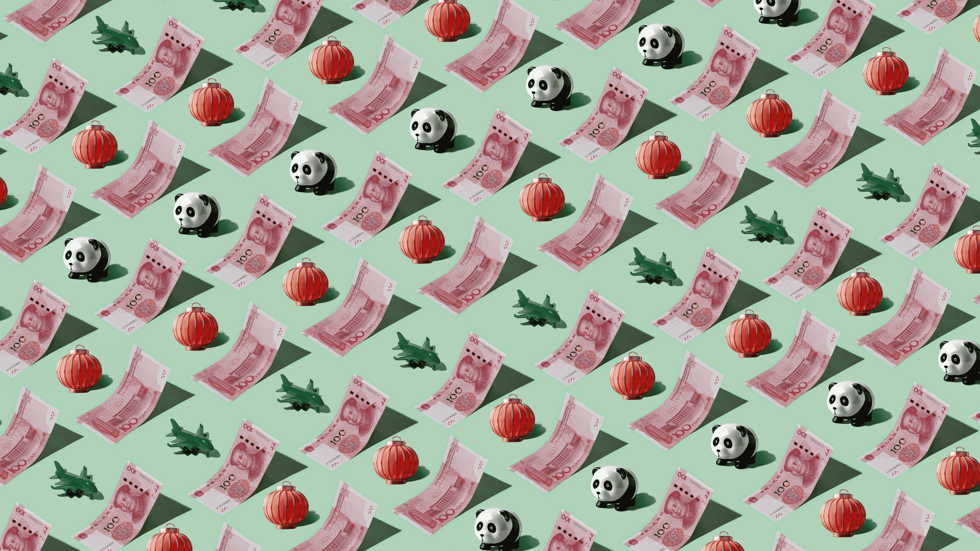 Chinese Yuan CNY) currency banknotes laid out in a repeating playful pattern with a green plane, red lantern, and panda figurine for Travel Money Oz.