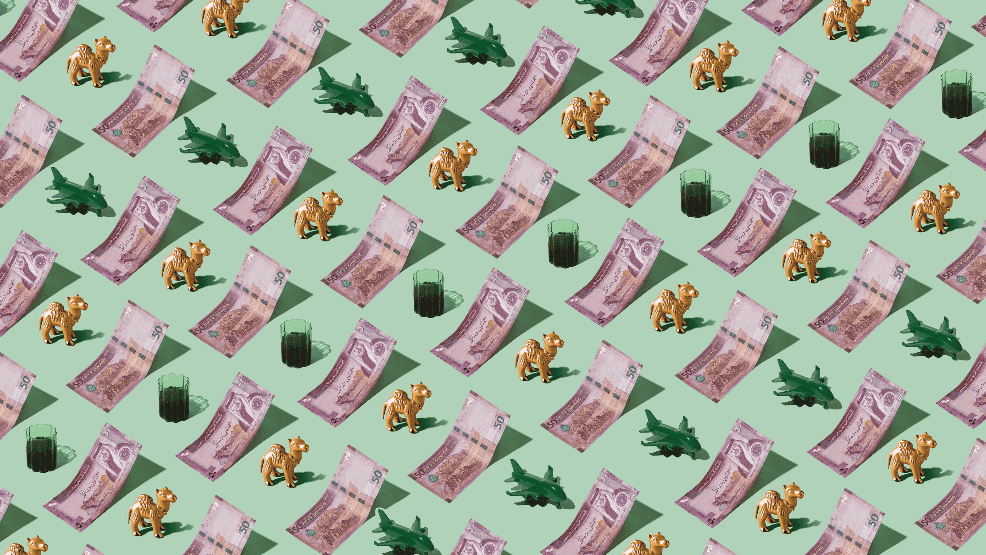 Jordanian Dinar (JOD) currency banknotes laid out in a repeating playful pattern with a green plane, Bedouin tea, and camel figurine for Travel Money Oz.