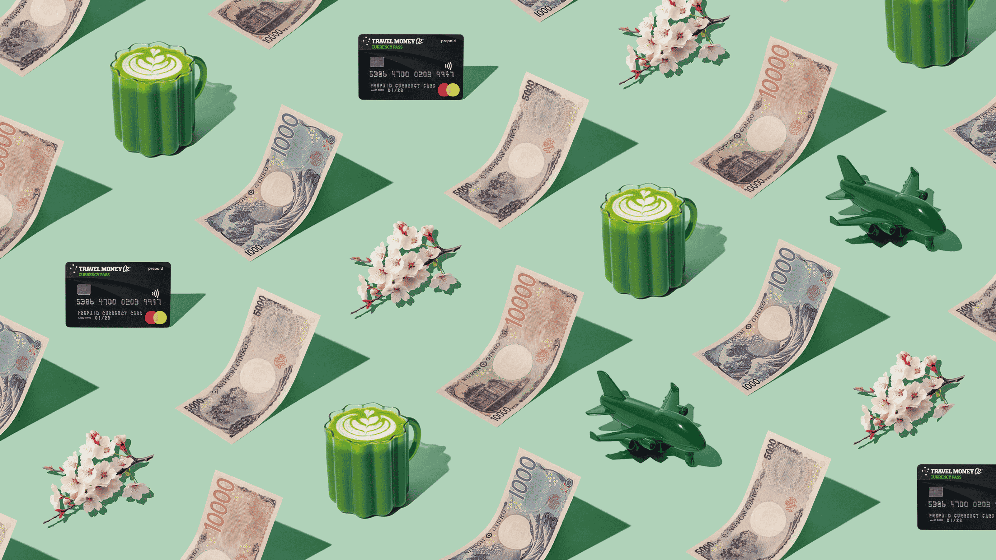 Japanese Yen (JPY) currency banknotes and Travel Money Oz Currency Pass prepaid travel card laid out in a repeating playful pattern with a green plane, cherry blossoms and matcha latte for Travel Money Oz.