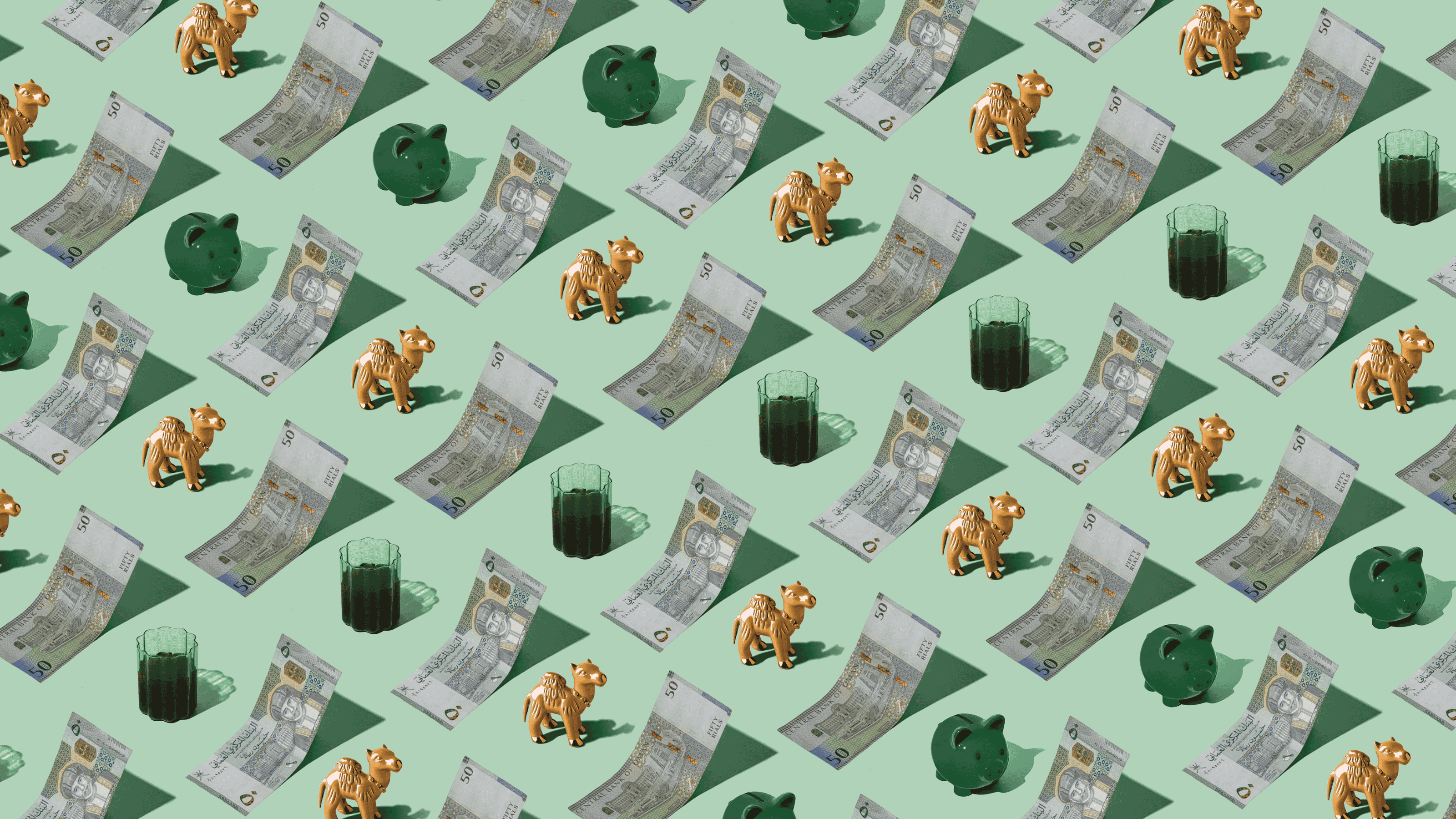 Omani Rial (OMR) currency banknotes laid out in a playful pattern with a camel figurine, tea, and green piggybank for Travel Money Oz.