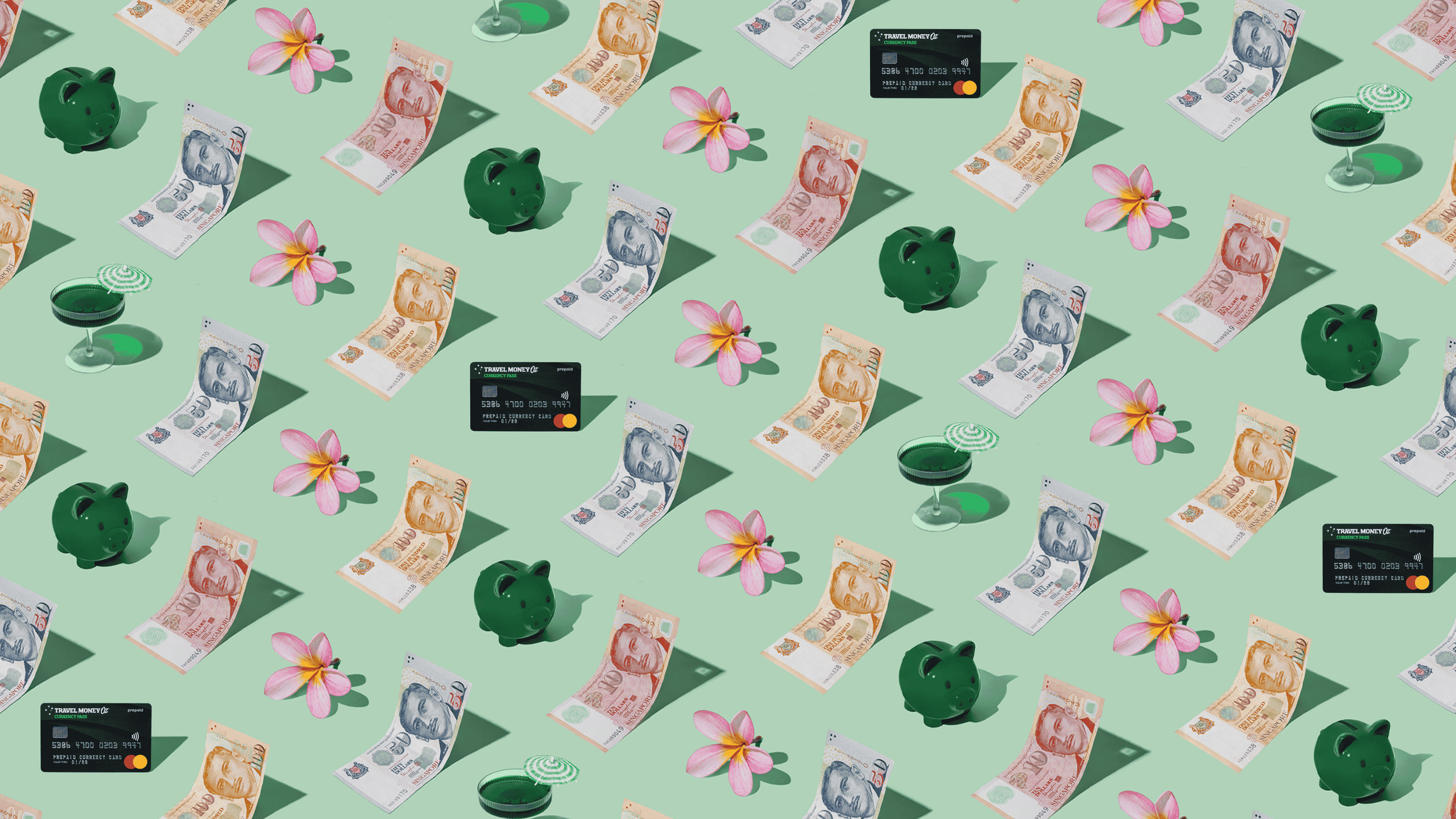 Singapore Dollars (SGD) currency banknotes and Travel Money Oz Currency Pass prepaid travel card laid out in a playful pattern with a green piggybank, cocktail, and frangipani flower for Travel Money Oz.