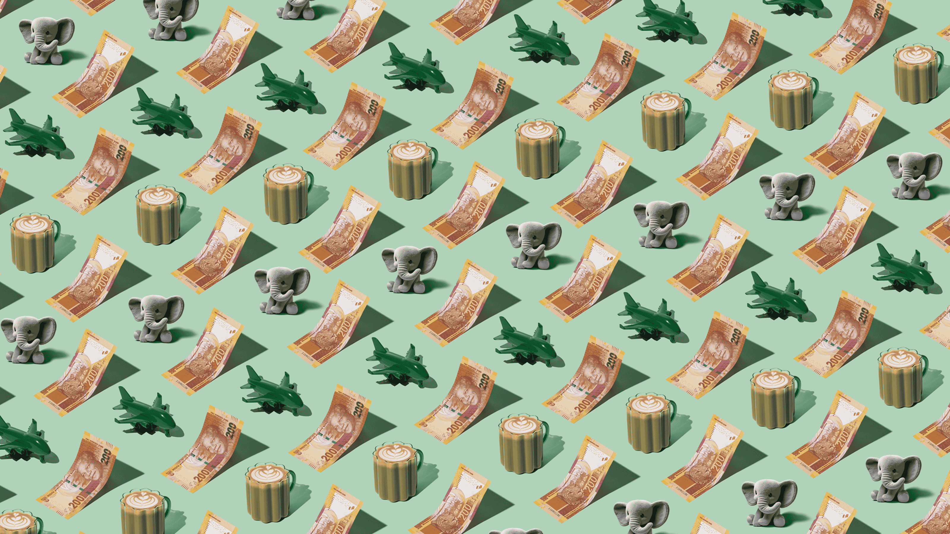 South African Rand (ZAR) currency banknotes laid out in a playful pattern with elephant plush toy, green plane, and coffee for Travel Money Oz.