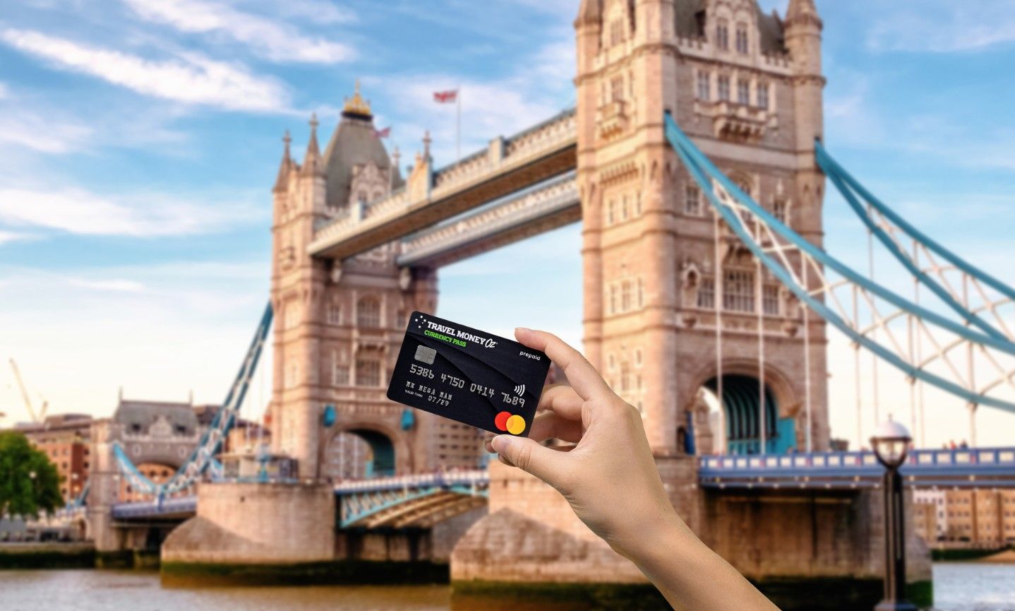 Using Currency Pass travel money card in the UK, featuring Tower Bridge in London