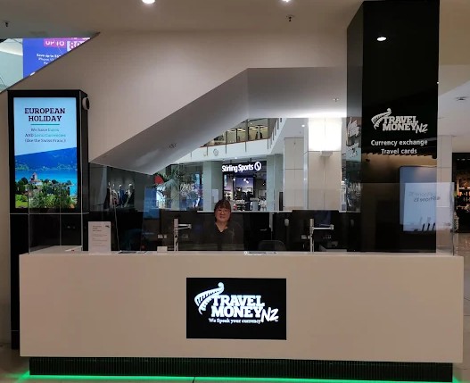 Travel Money NZ St Lukes Auckland store showing currency exchange counter and customer service area
