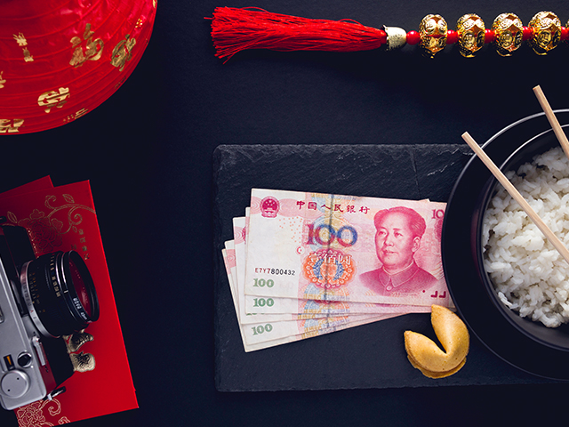 Chinese Yuan notes, rice and fortune cookie