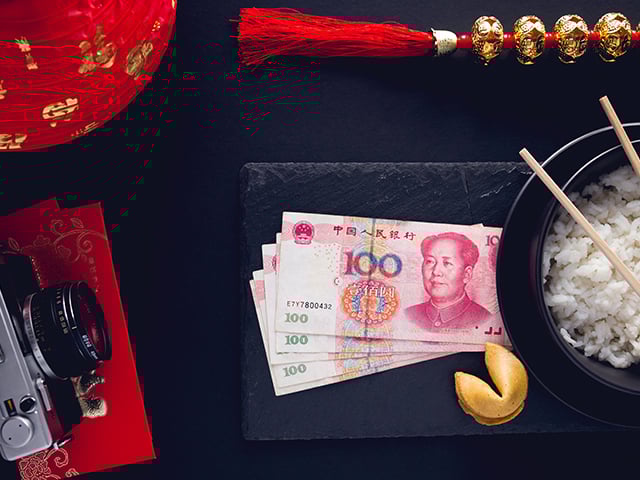 Chinese Yuan notes, rice and fortune cookie