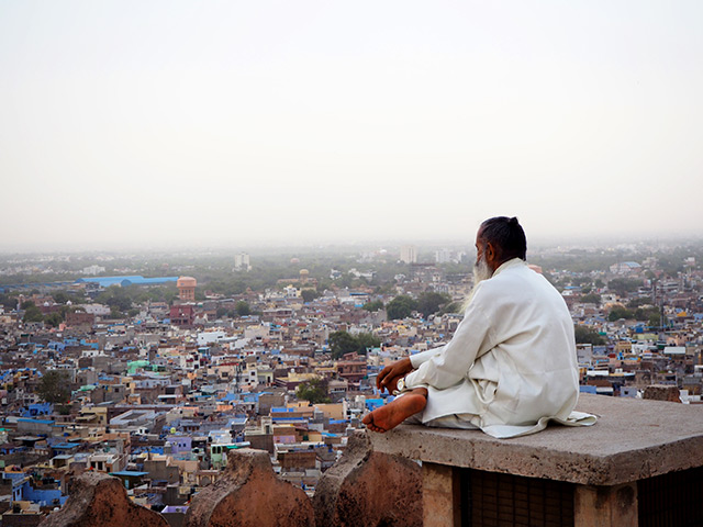 Man overlooking Indian city 