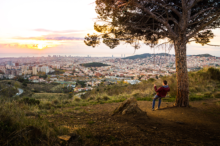 Boy overlooking Spanish city