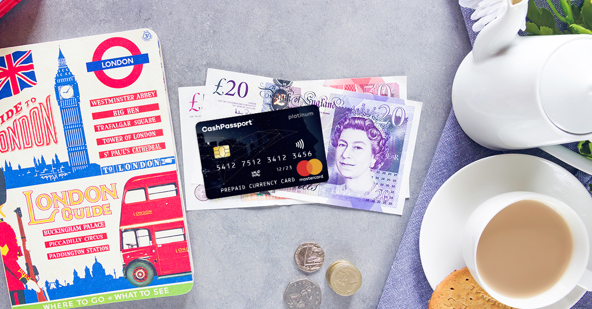 Great British Currency with travel money card and cup of tea
