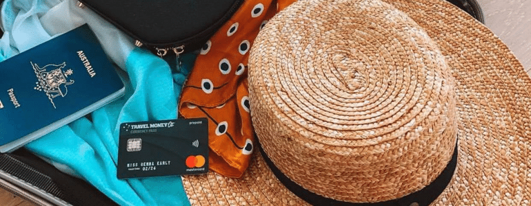 Travel Money Oz Currency Pass multicurrency card among luggage for tropical jungle holiday in South America