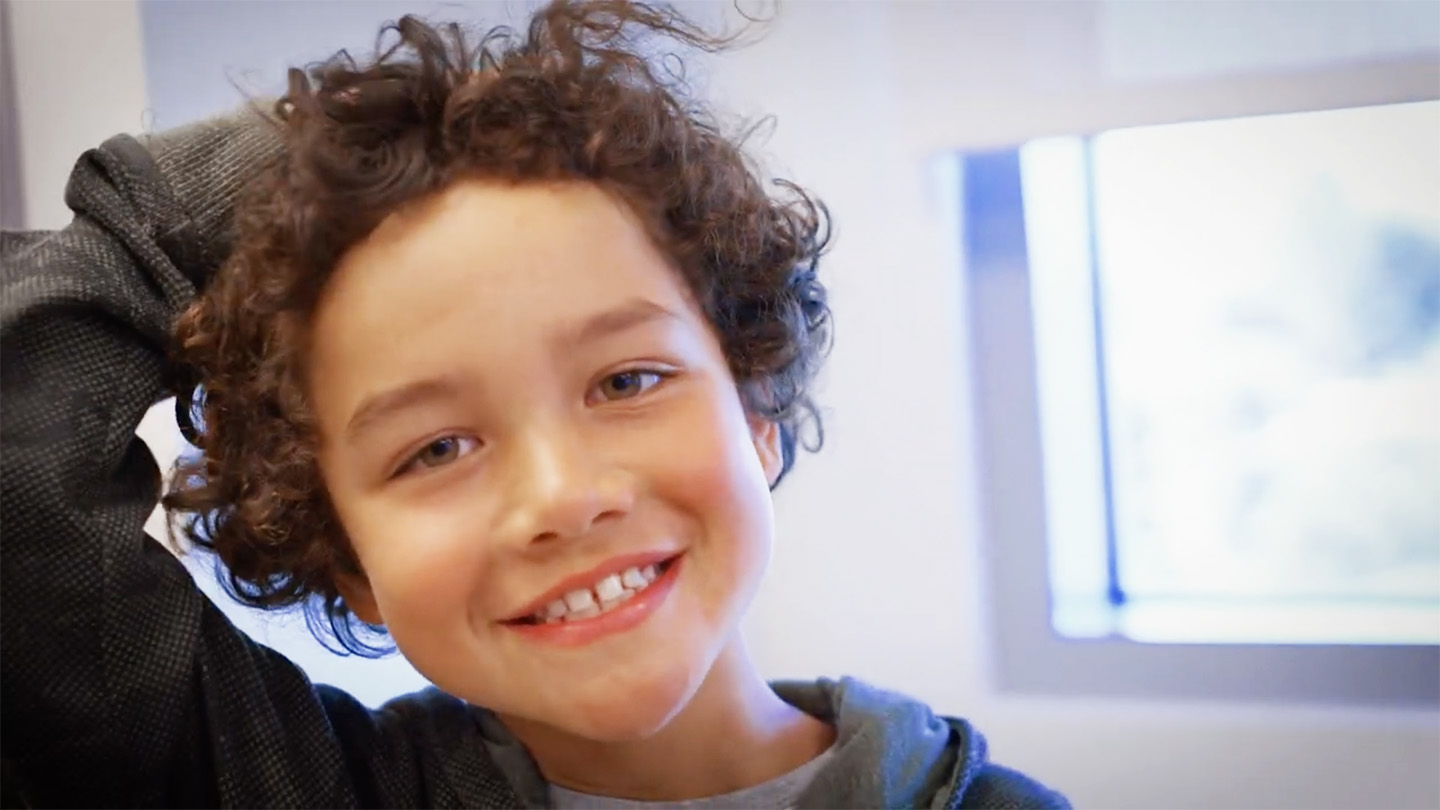 Smiling boy with curly hair