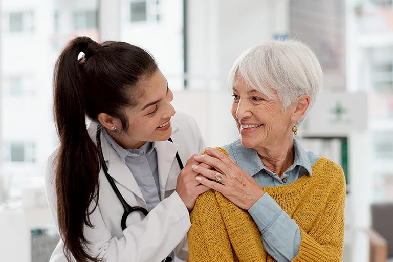 A healthcare professional smiling to a patient