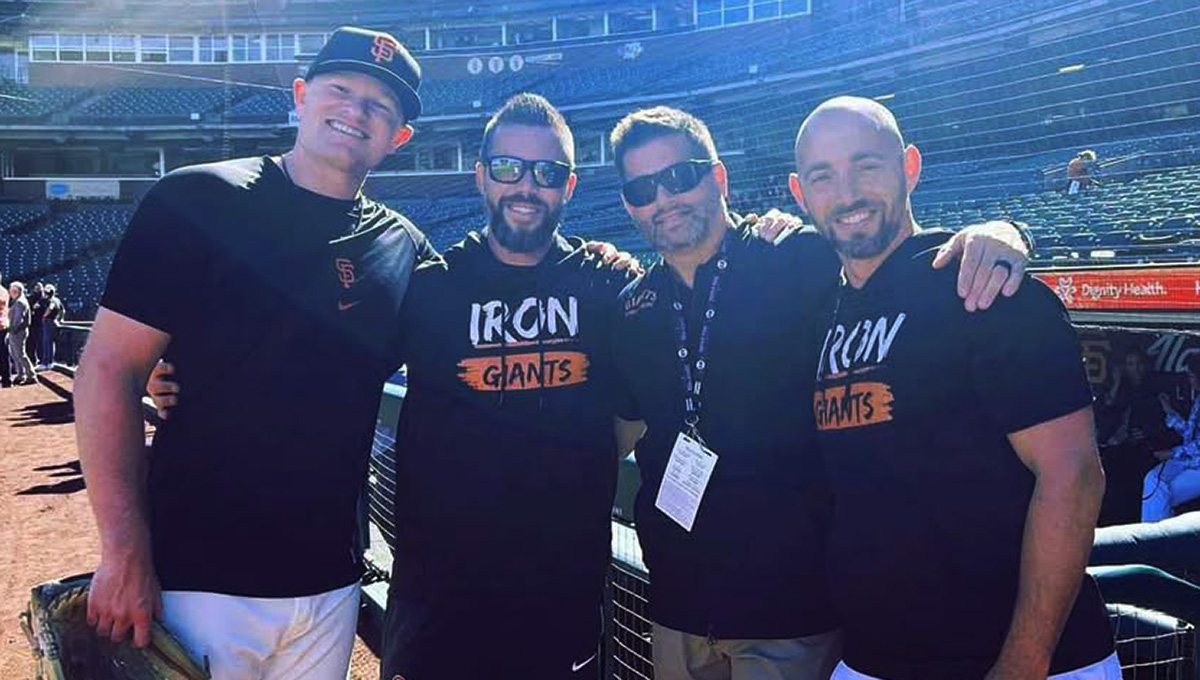 Group of four man, smiling together
