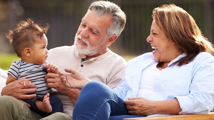 Older Hispanic couple with grandson