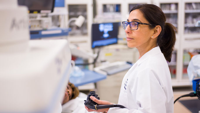Uzma Siddiqui, MD, interventional endoscopist, in the endoscopy lab with patient