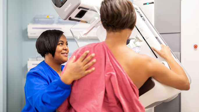 UChicago Medicine mammography technician with patient who is getting mammogram