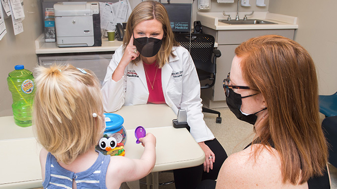 Image of speech language pathologist Michelle Havlik working with a young patient
