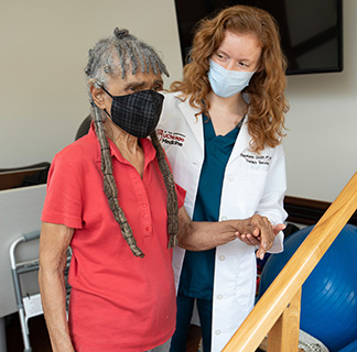 Stephanie Groth with physical therapy patient