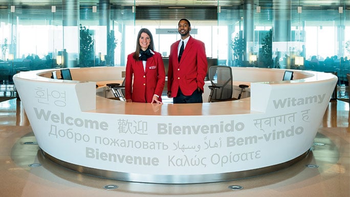 Greeters at Sky Lobby welcome desk in the Center for Care and Discovery