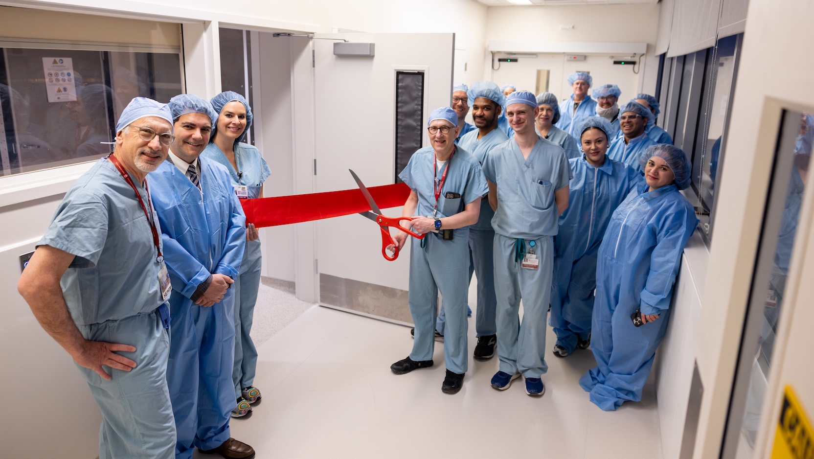 The Department of Neurological Surgery cuts ribbon in front of intraoperative MRI