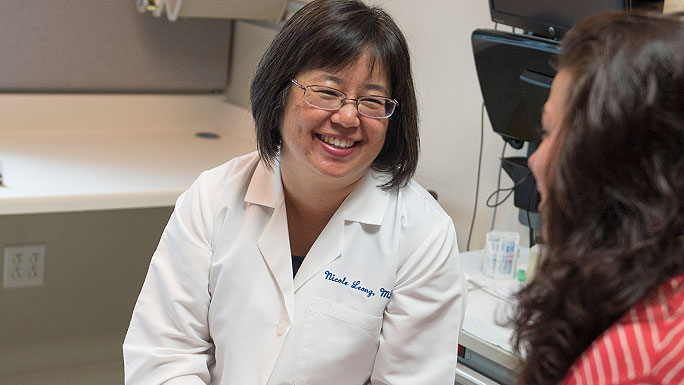 Dr. Nicole Leong consults with a gynecology patient