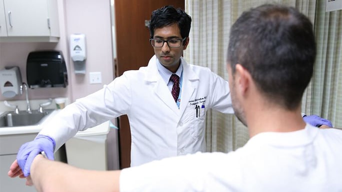 Dr. Athiviraham evaluates shoulder injury