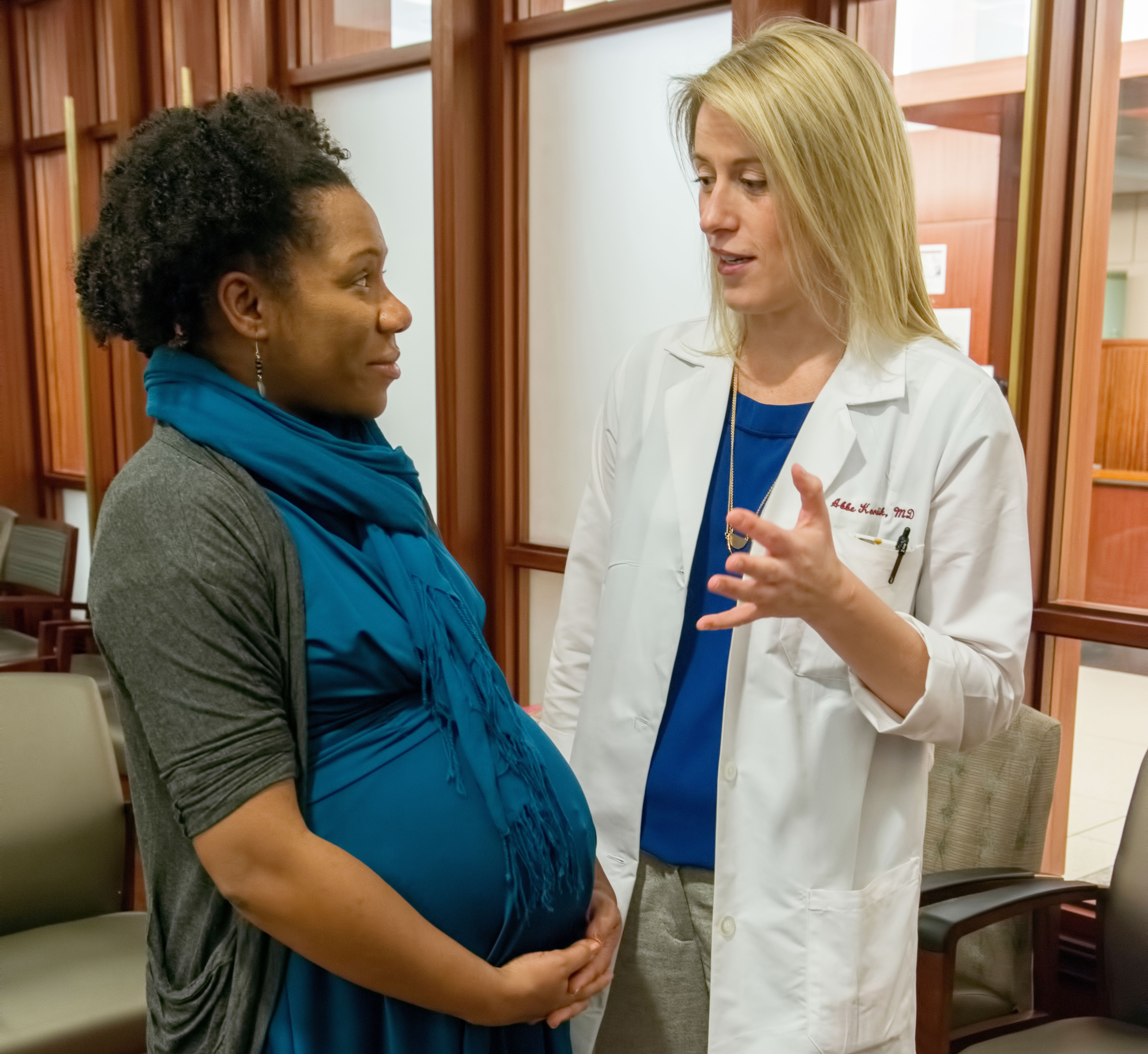 Obstetrician Abbe Kordik, MD, consults with a pregnant patient