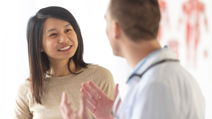 Woman meeting with primary care physician